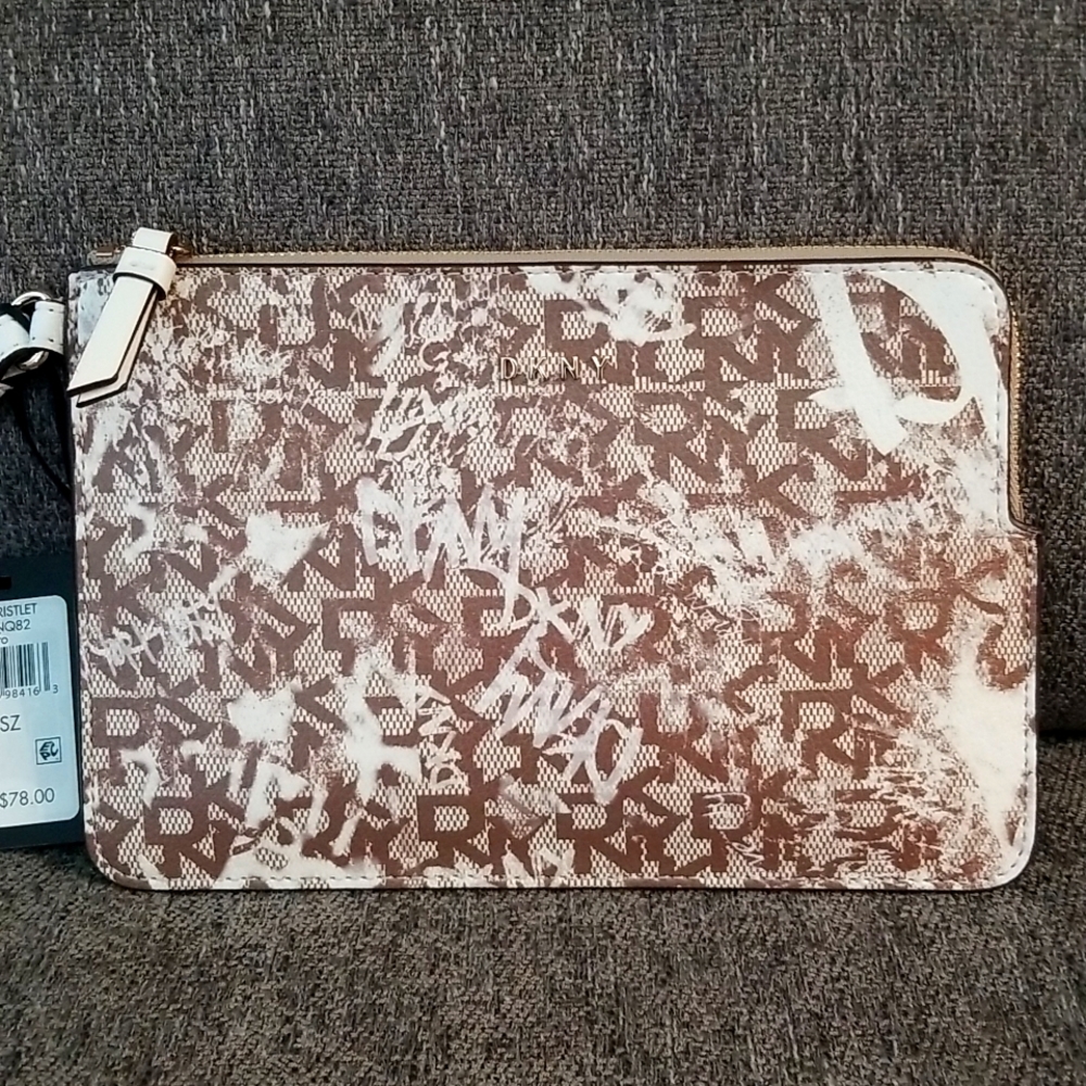 Nwt DKNY medium brown graffiti wristlet. Retails $78